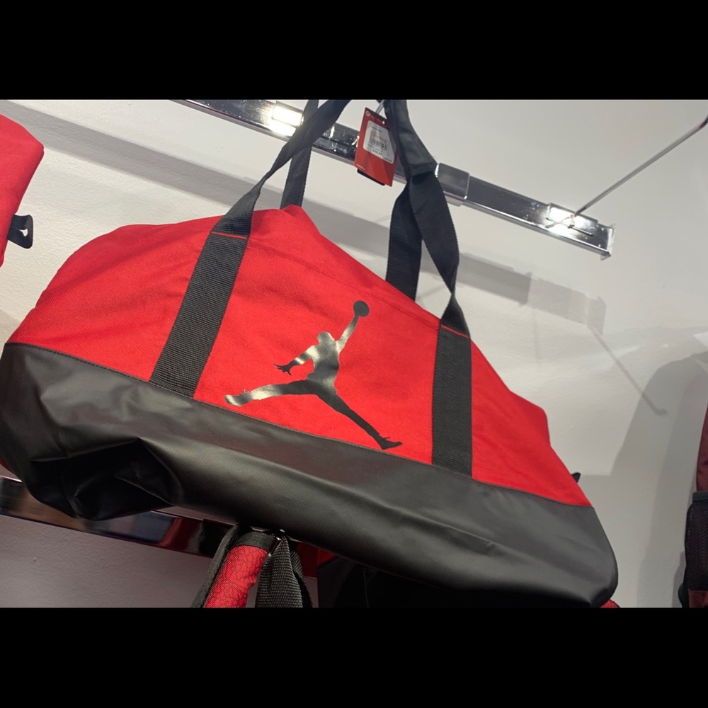 Red and black duffle bag